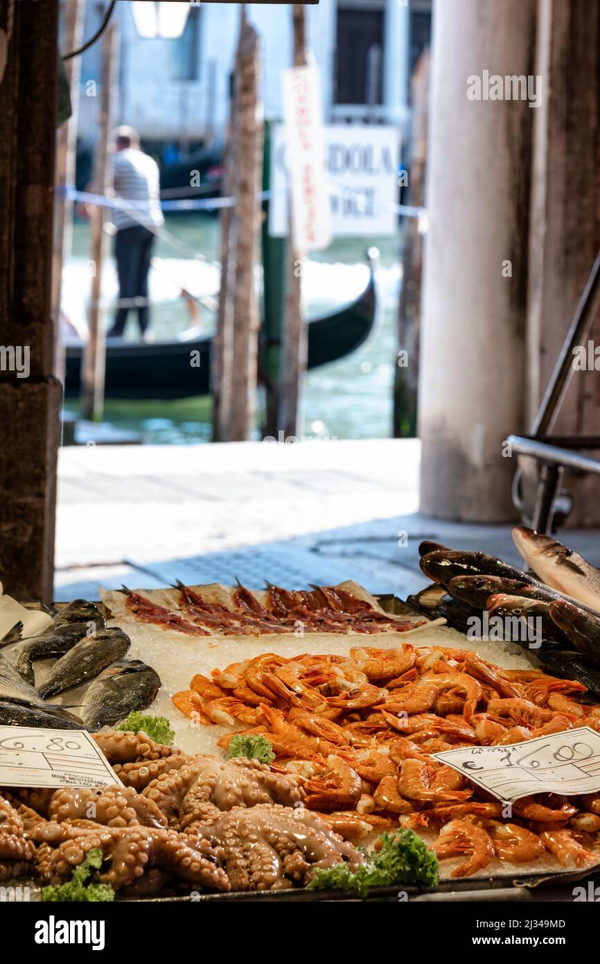 View of the display at the fish market in Venice, in the background a gondolier, Venice, Veneto, Italy, Europe Stock Photo