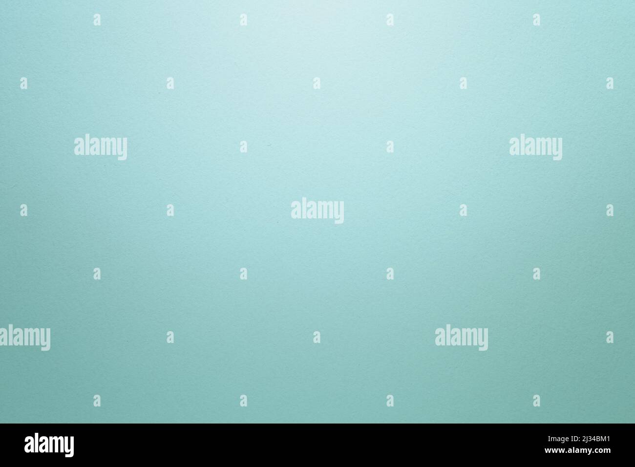 Light turquoise textured paper background with light effect. Copy space ...