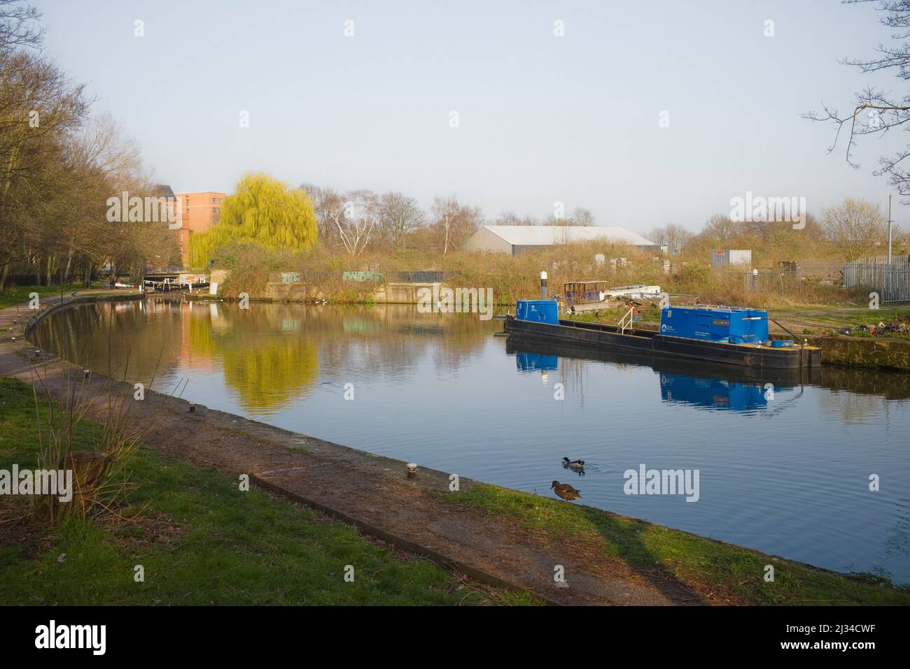 Leicester Arm of the Grand Union Canal with Memory Lane moorings on the right and lock 43 Lime Kiln lock in the distance. Stock Photo