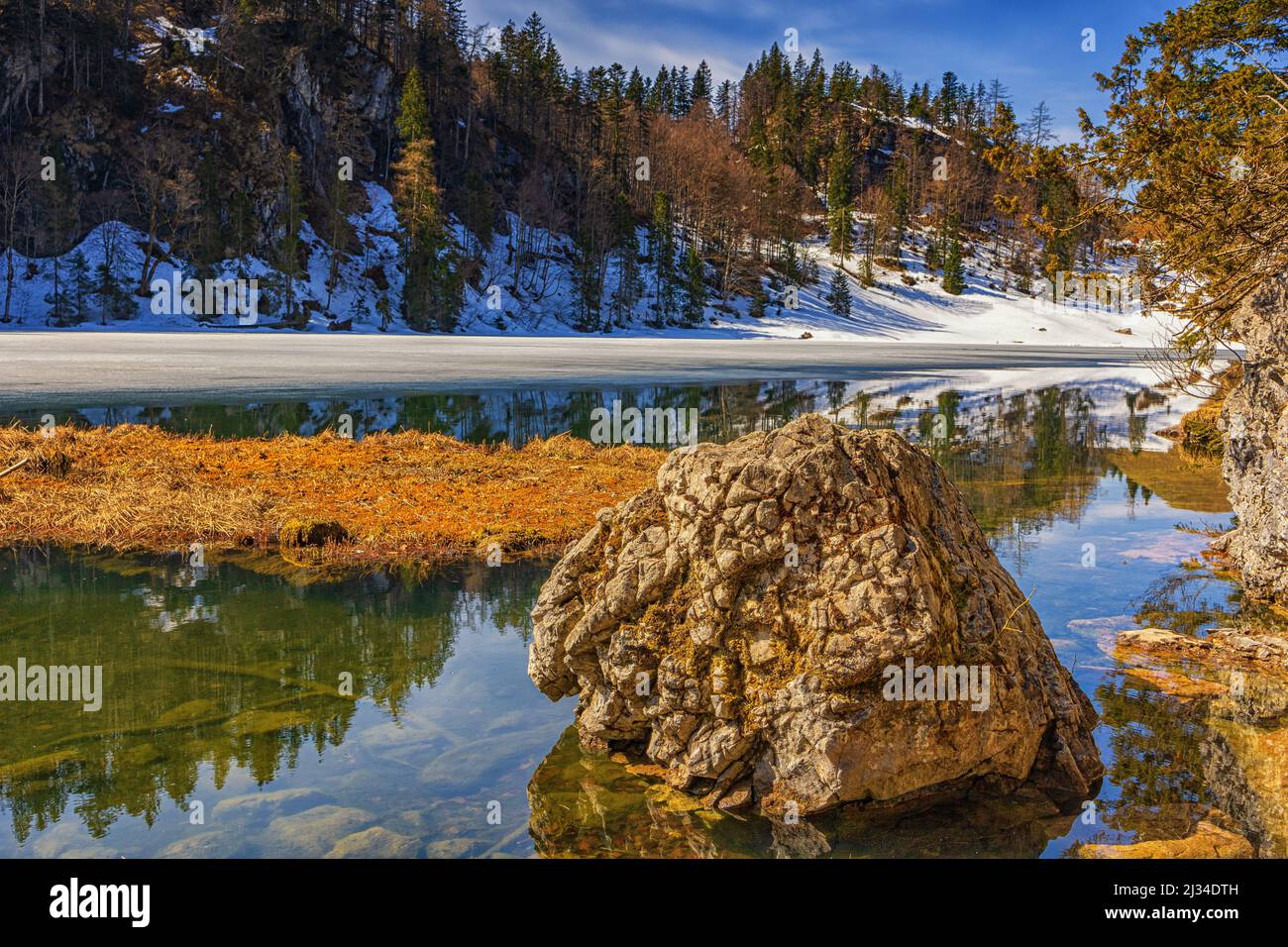 Taubensee with ice cover, Stein in the foreground, Reit im Winkl, Upper Bavaria, Bavaria, Germany Stock Photo