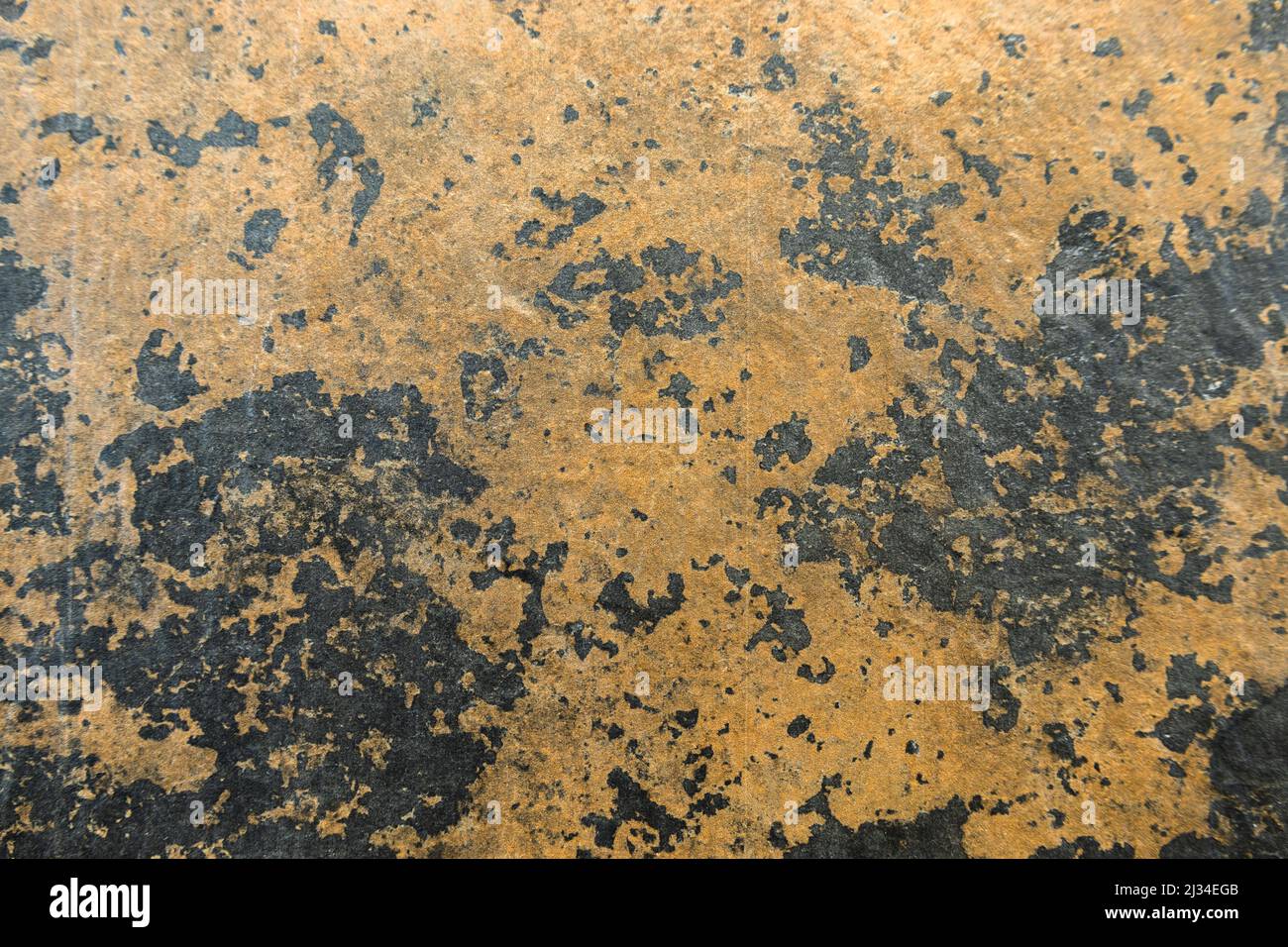 Stained rusty peeled textured wall surface background Stock Photo