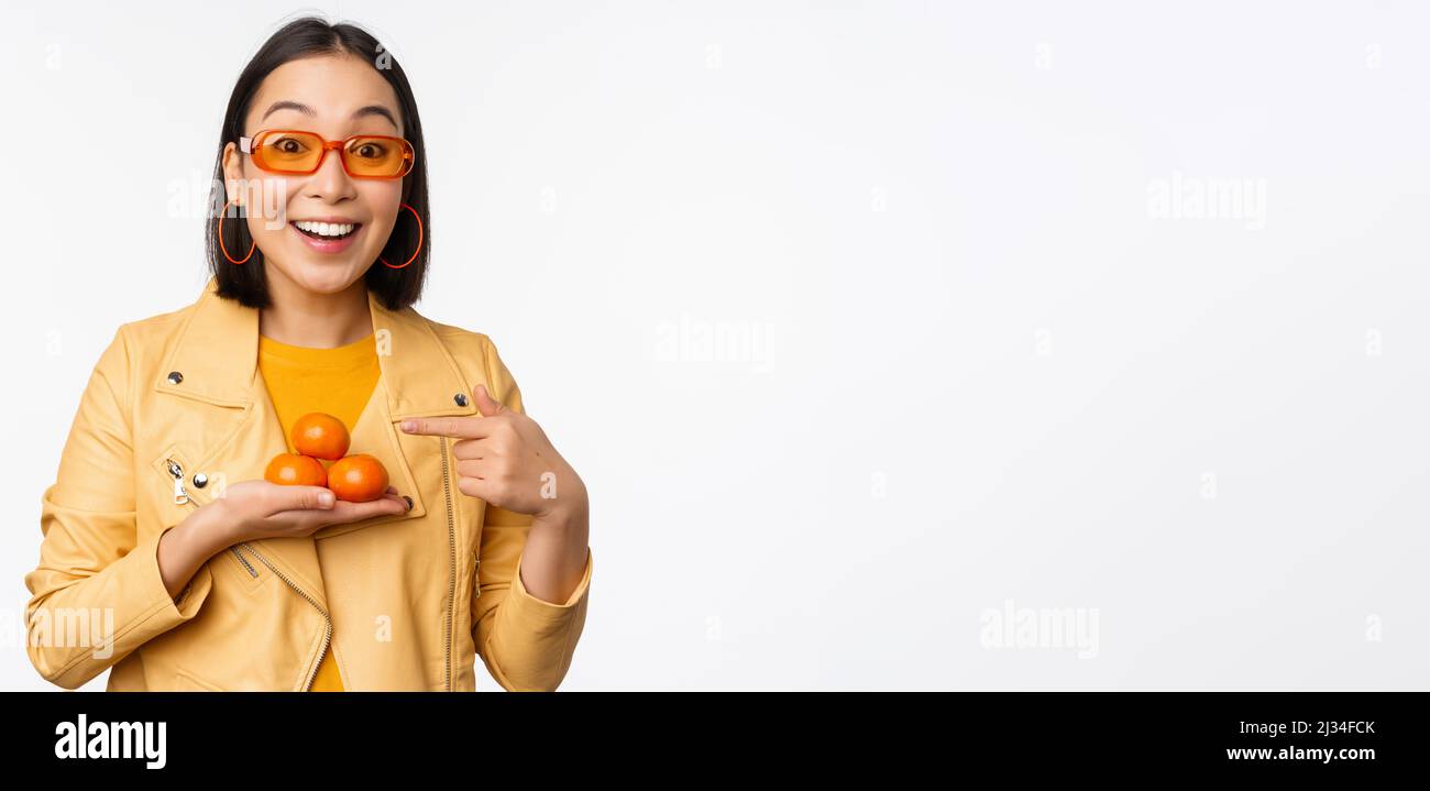 Attractive woman tangerine hi-res stock photography and images - Alamy
