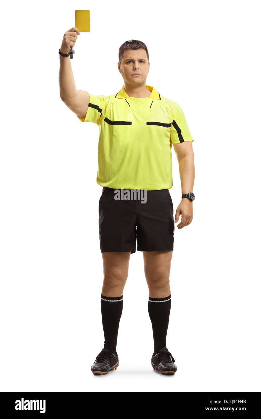 Full length portrait of a football referee giving a yellow card