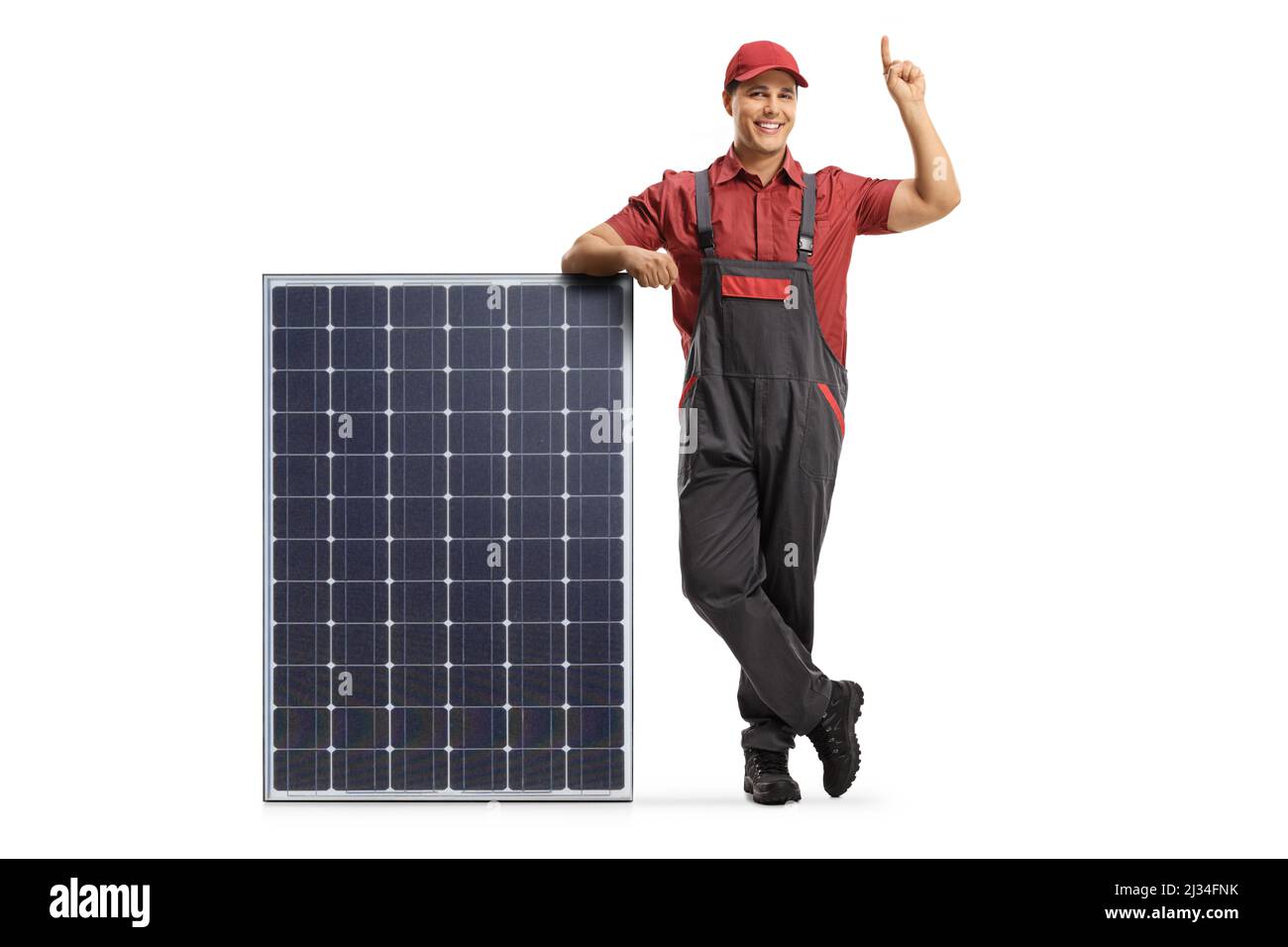 Electrician leaning on a solar panel and pointing up isolated on white ...
