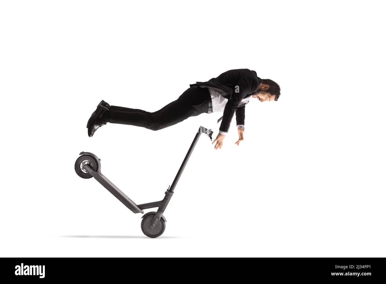 Businessman falling from an electric scooter isolated on white background Stock Photo