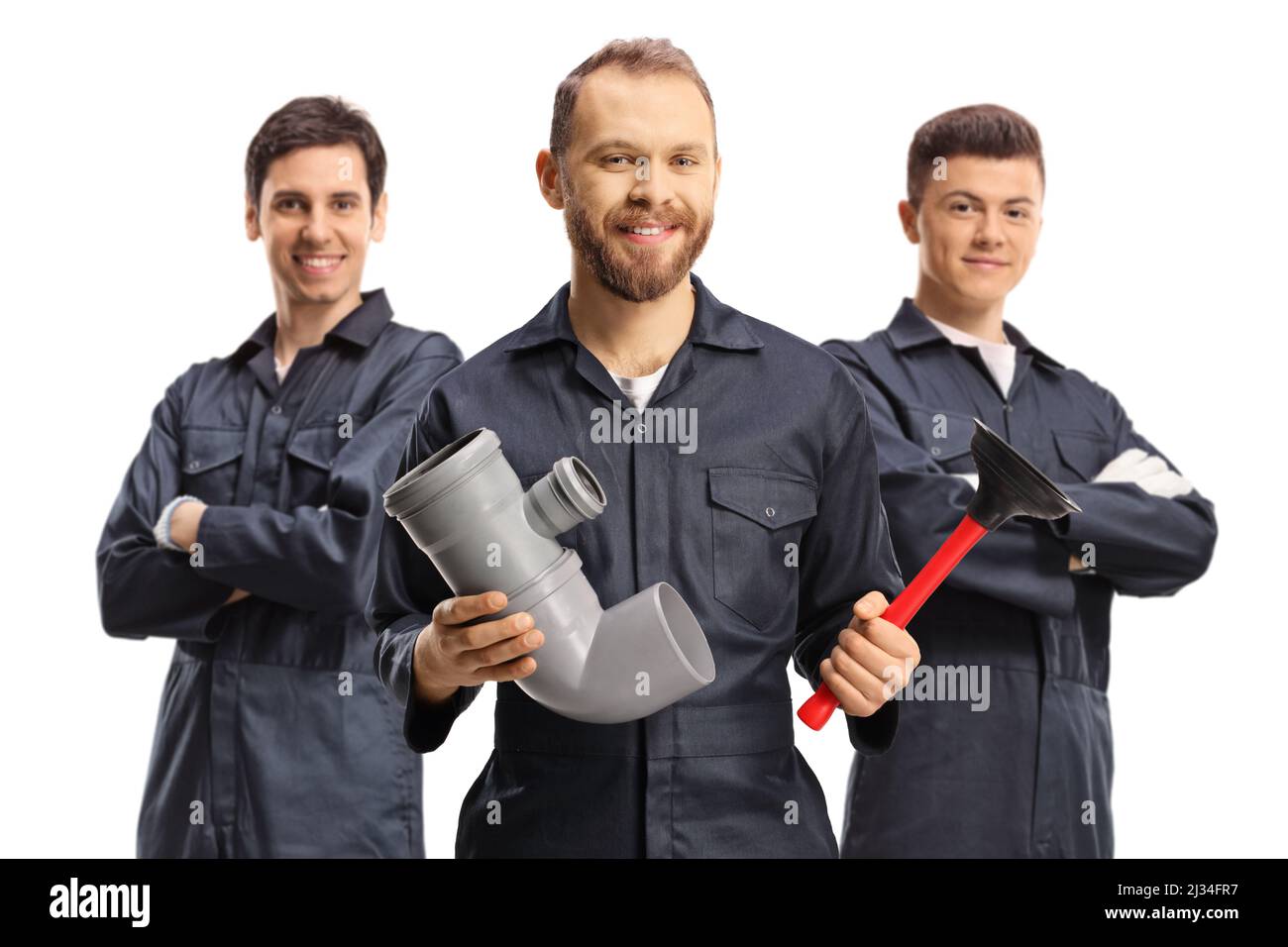 Three plumbers in uniforms holding working tools isolated on white