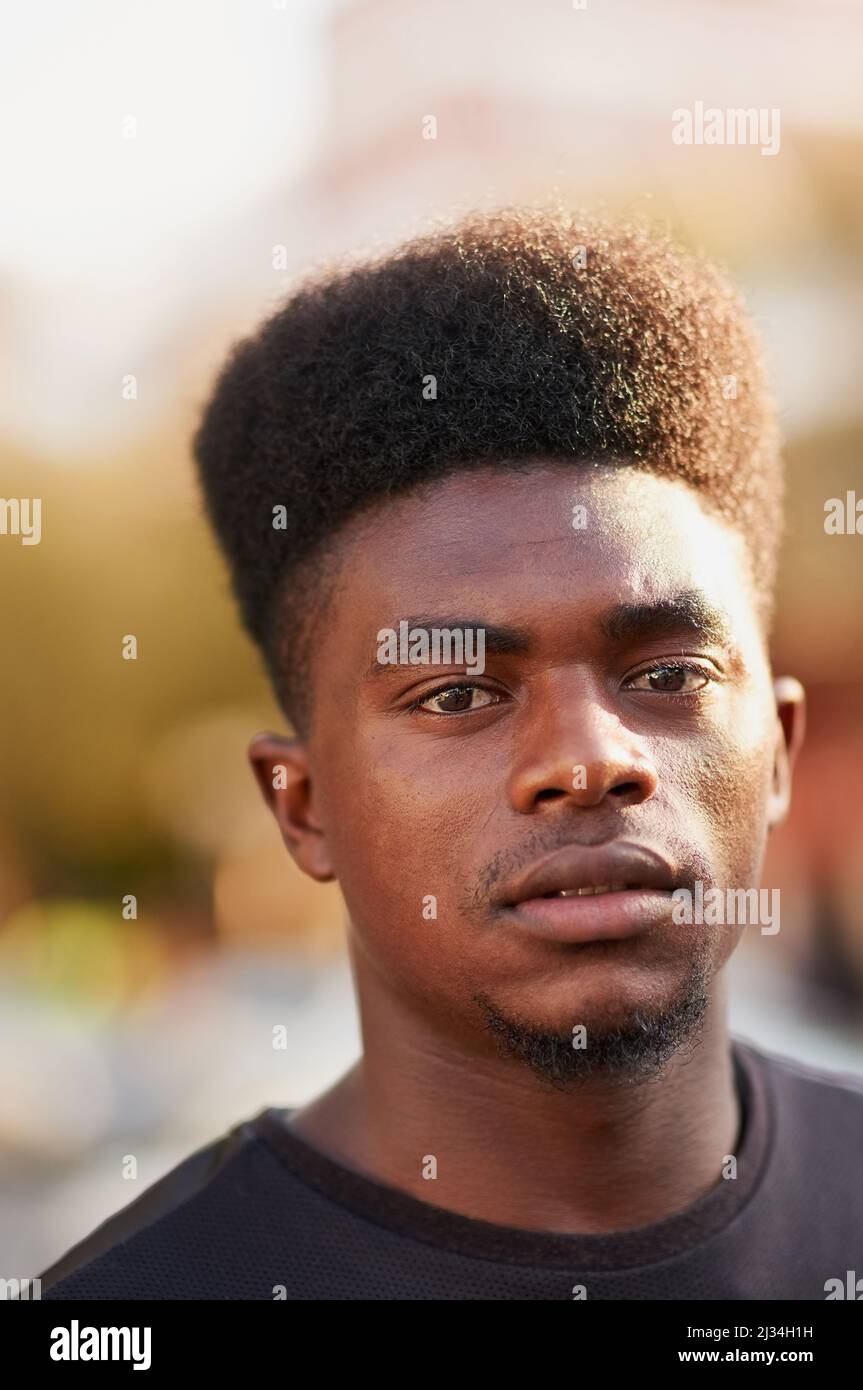 Reviving the high top fade. Portrait of a young man with high top fade posing outdoors. Stock Photo