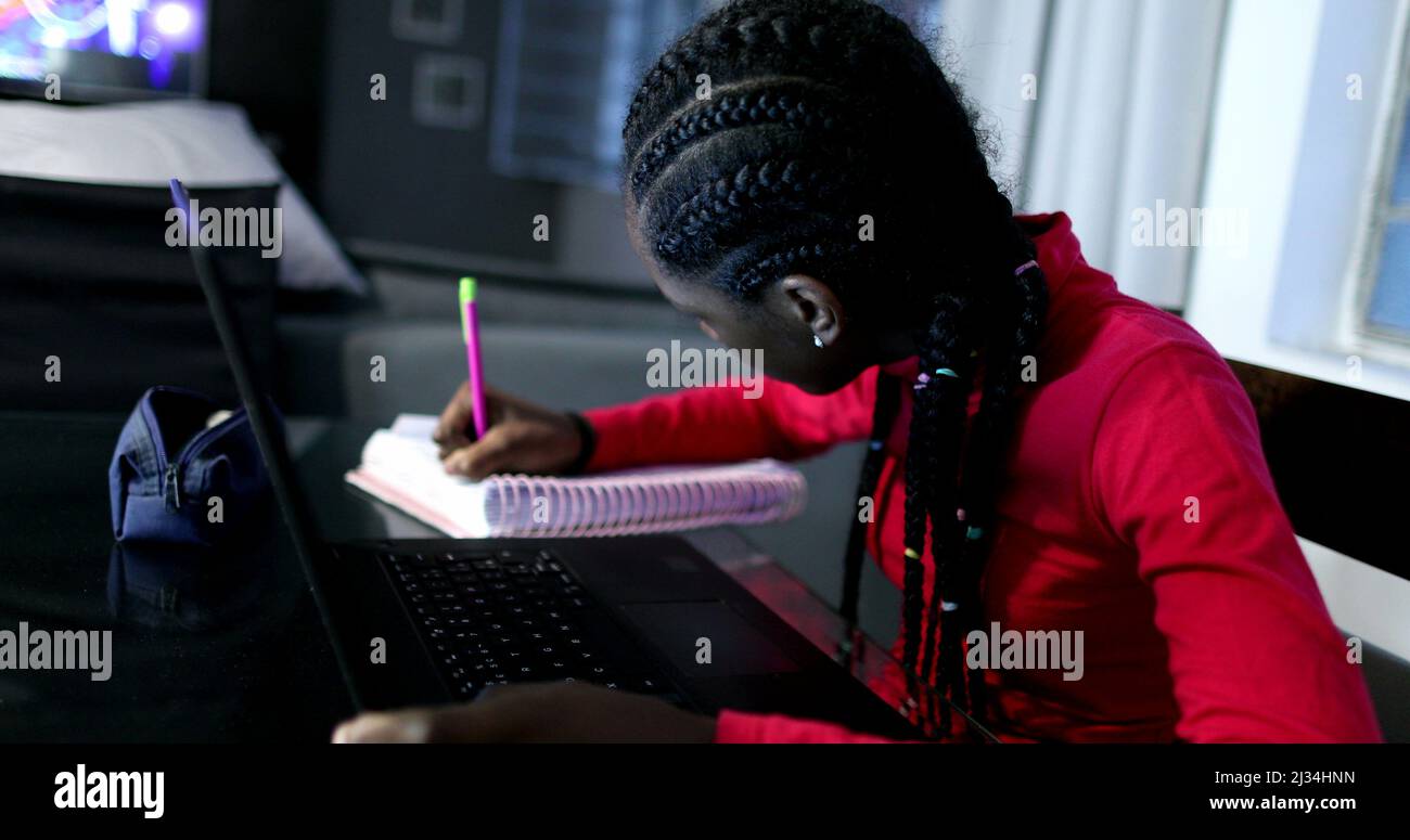 Candid black girl studying at night in front of laptop computer Stock ...