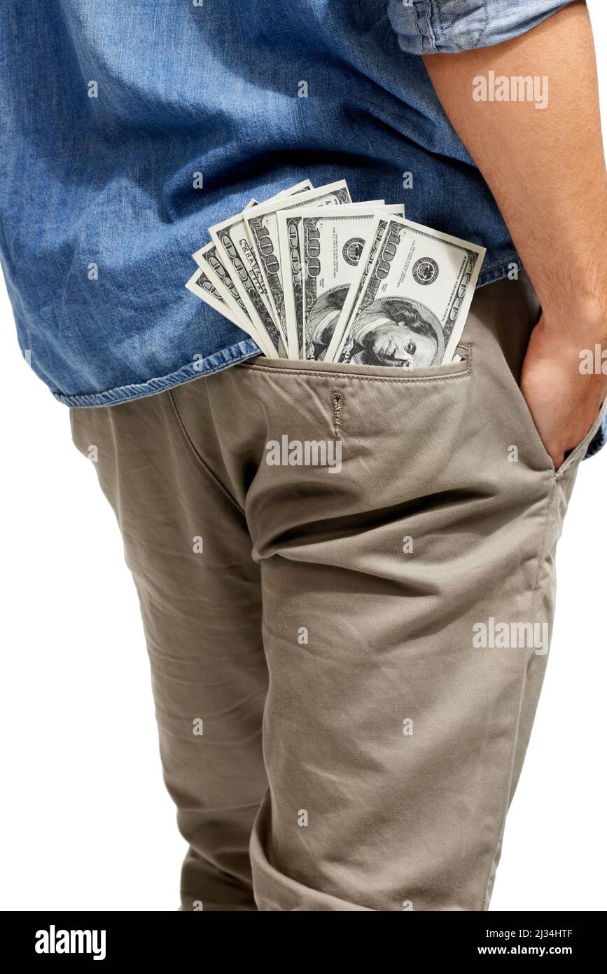 Lots to spend. Cropped image of a wad of cash sticking out of a mans pocket. Stock Photo