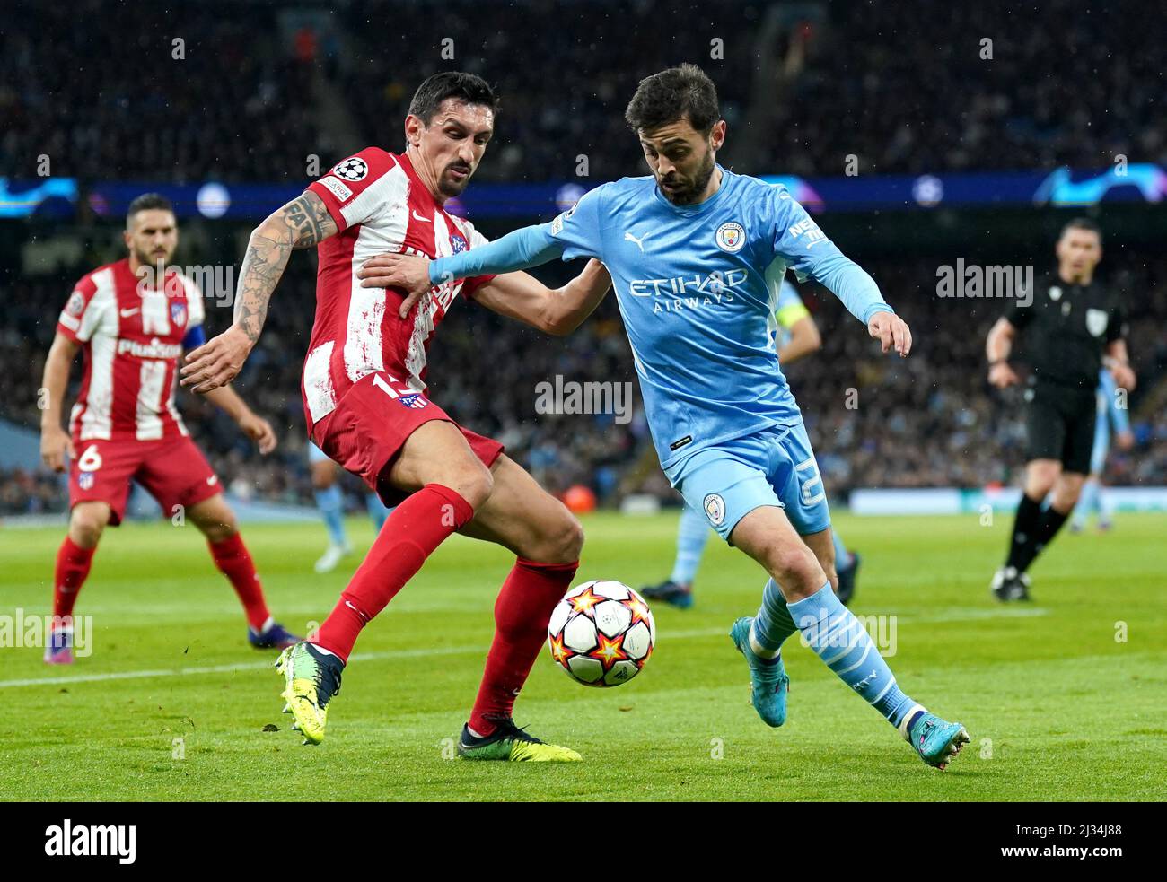 Manchester City's Bernardo Silva (right) and Atletico Madrid's Stefan Savic battle for the ball during the UEFA Champions League Quarter Final first leg match at the Etihad Stadium, Manchester. Picture date: Tuesday April 5, 2022. Stock Photo