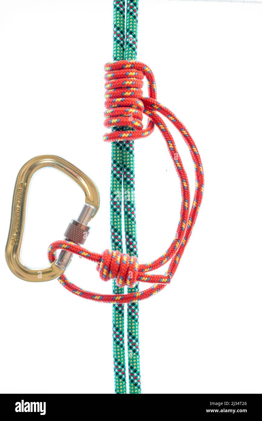 Prusik knot or hitch on a climbing rope and a carabiner cliped on the loop Stock Photo