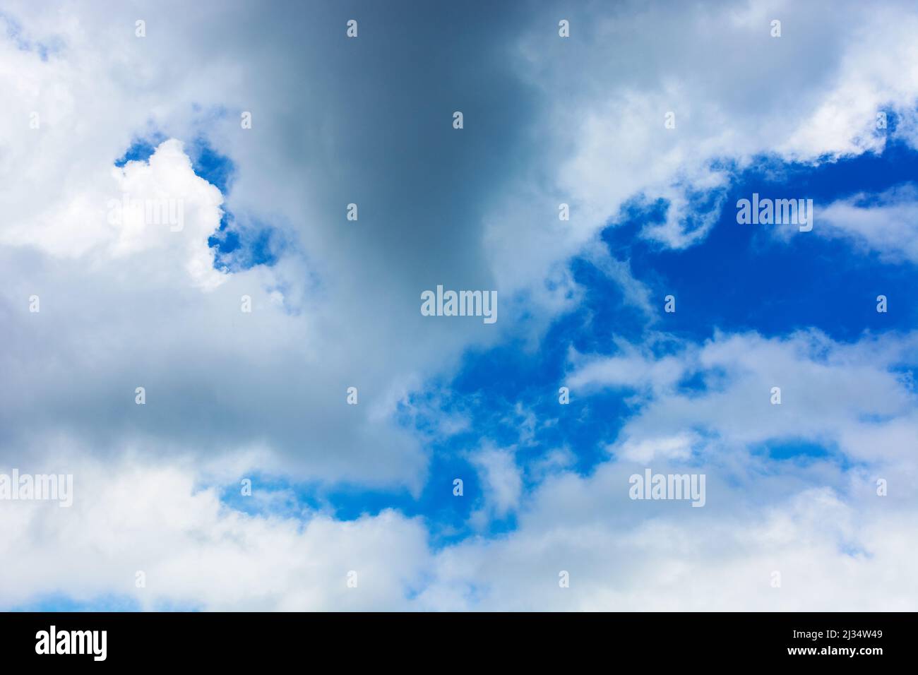 Fluffy Cumulus Clouds On A Blue Sky Beautiful Nature Background In