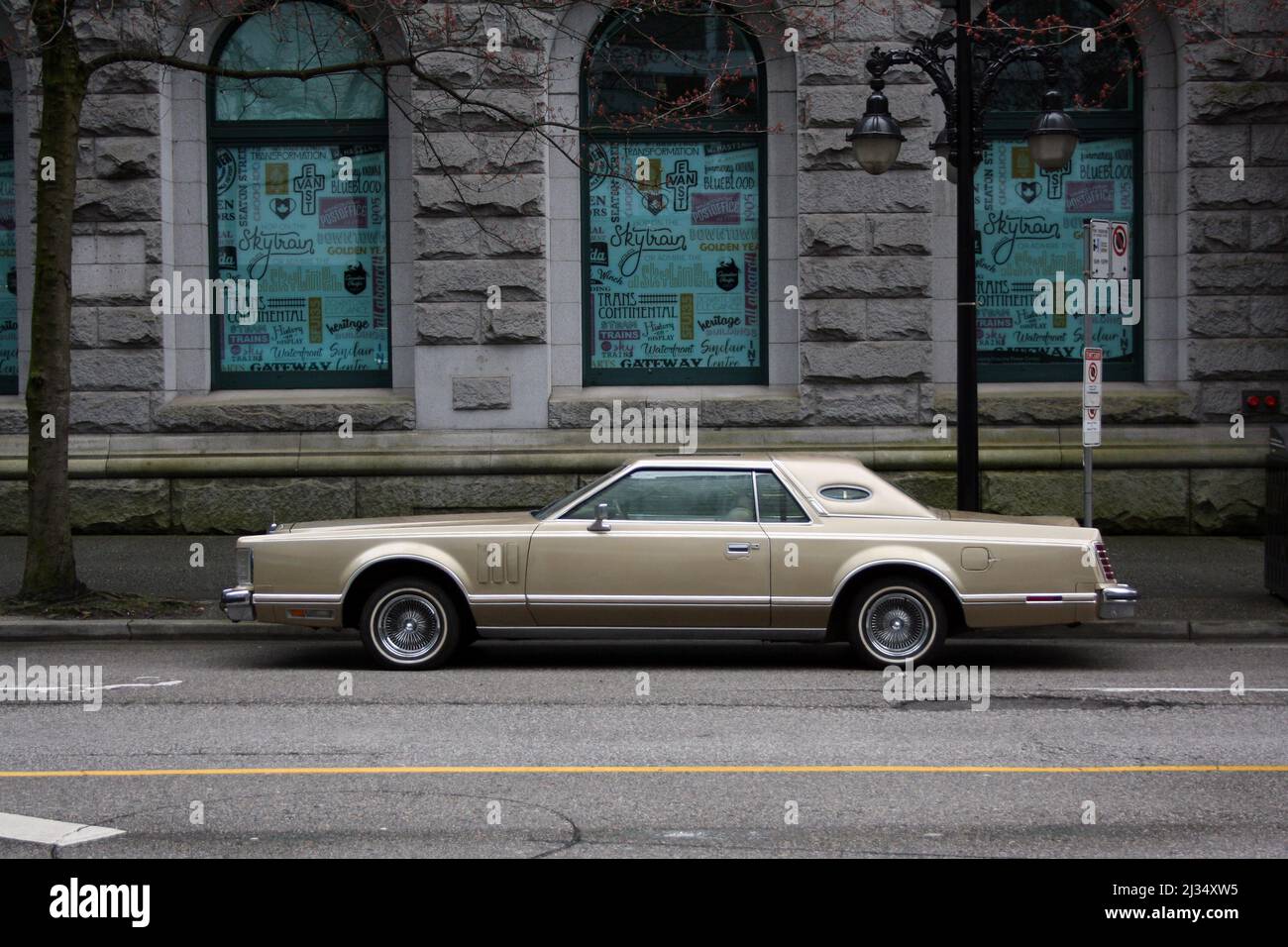 A classic American car parked in downtown Vancouver, British Columbia