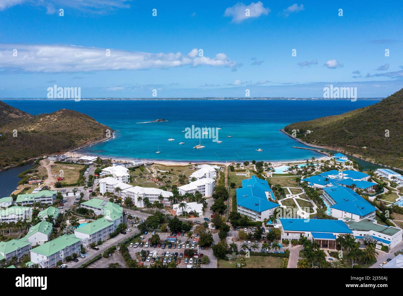 An aerial shot of the Anse Marcel beach with hotels and resorts on