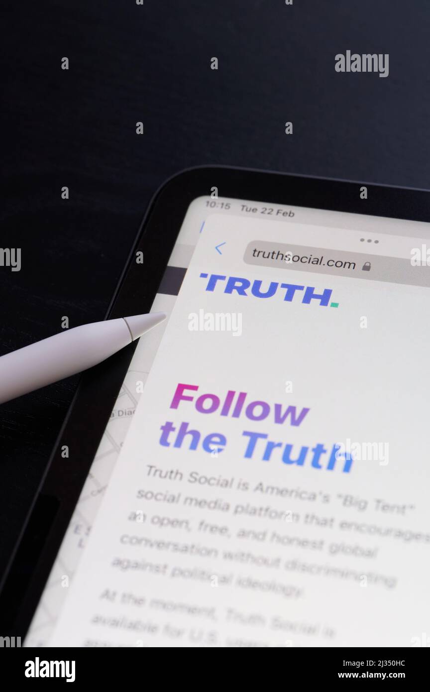 New york, USA - February 22 2022: Follow the truth on social media on tablet screen close up view Stock Photo