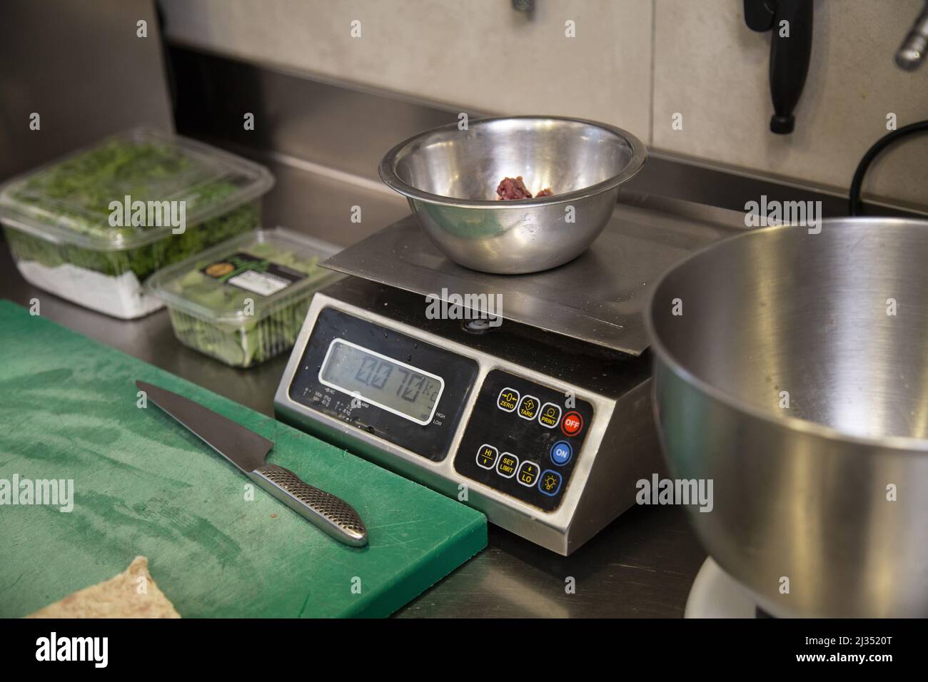 A weighing ingredients on the scales for cooking Stock Photo Alamy