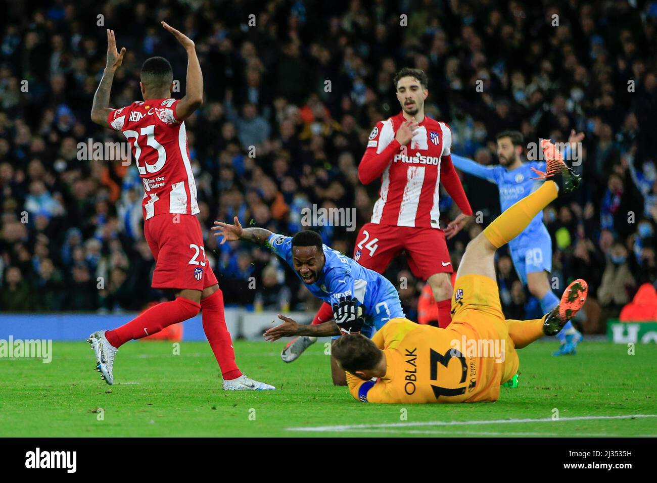 Manchester, UK. 05th Apr, 2022. Raheem Sterling #7 of Manchester City falls in the penalty area after a challenge by Reinildo Mandava #23 of Athletico Madrid but no penalty is given in Manchester, United Kingdom on 4/5/2022. (Photo by Conor Molloy/News Images/Sipa USA) Credit: Sipa USA/Alamy Live News Stock Photo