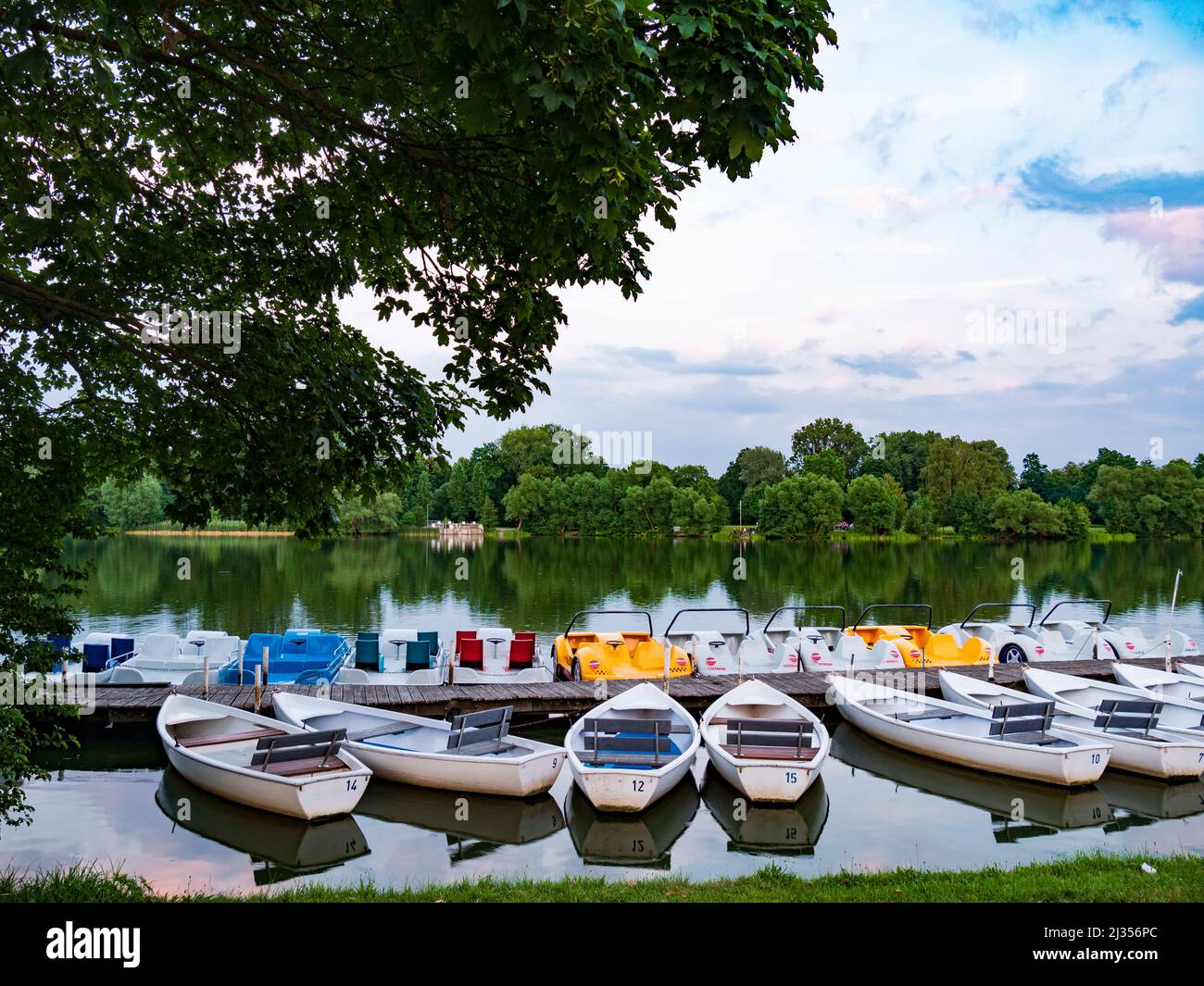 Rowing boats and pedal boats for rent at the landing stage in the lake