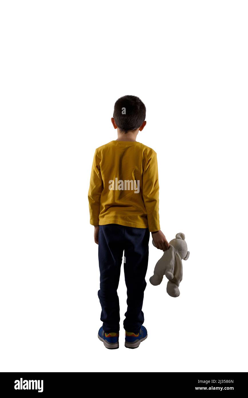 Child with teddybear in hand isolated on white background Stock Photo
