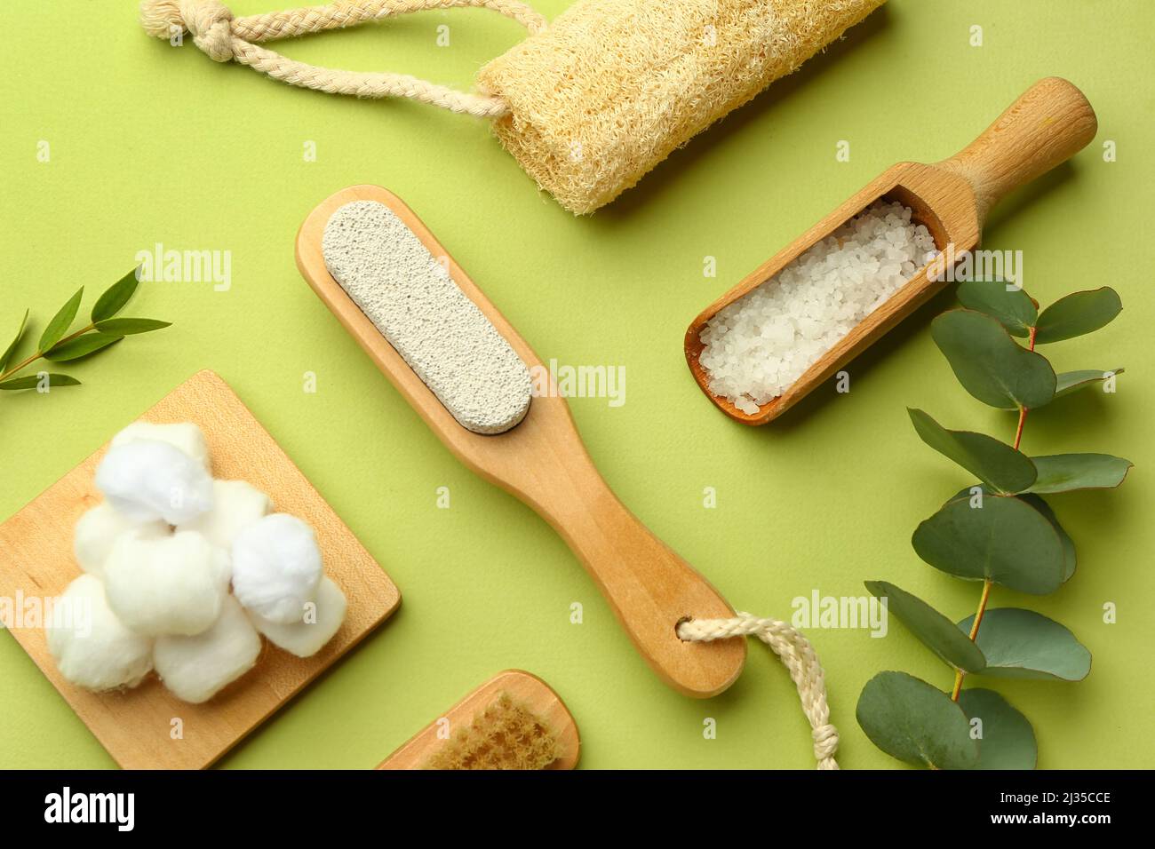 Set of bath supplies with eucalyptus branches on green background Stock