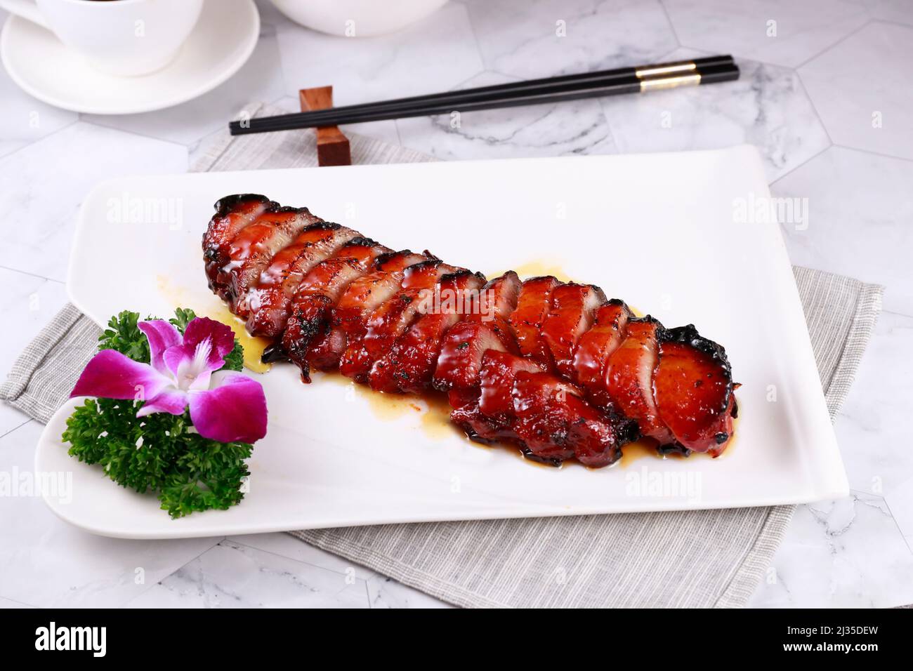spanish brisket in a dish isolated on grey background side view of Hong