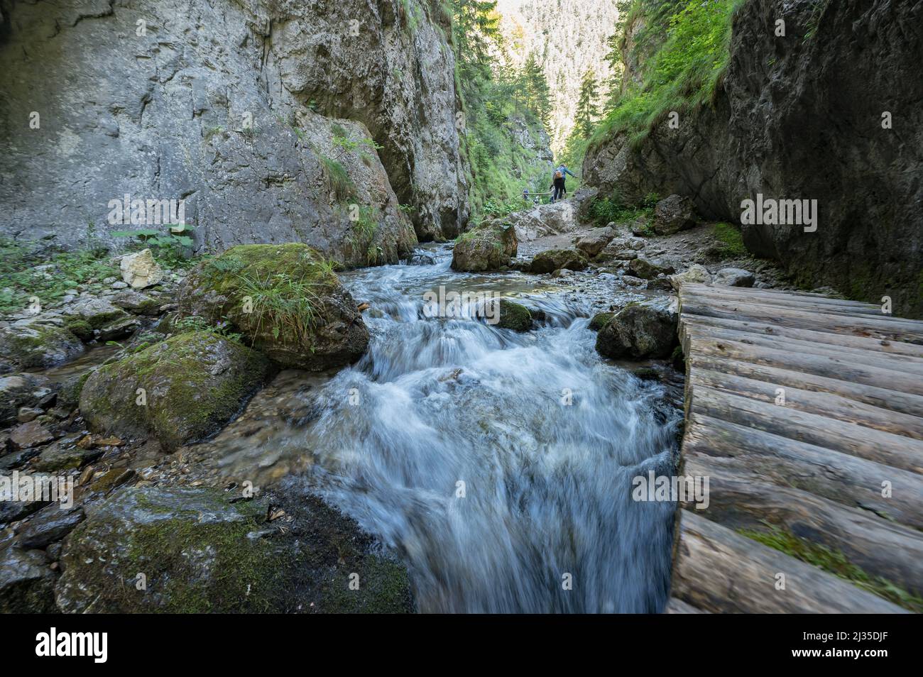 A beautiful shot of river and waterfall streaming from over rocky ...