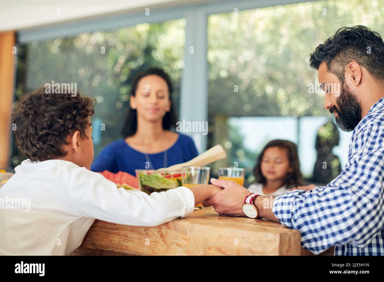 Children praying table hi-res stock photography and images - Alamy