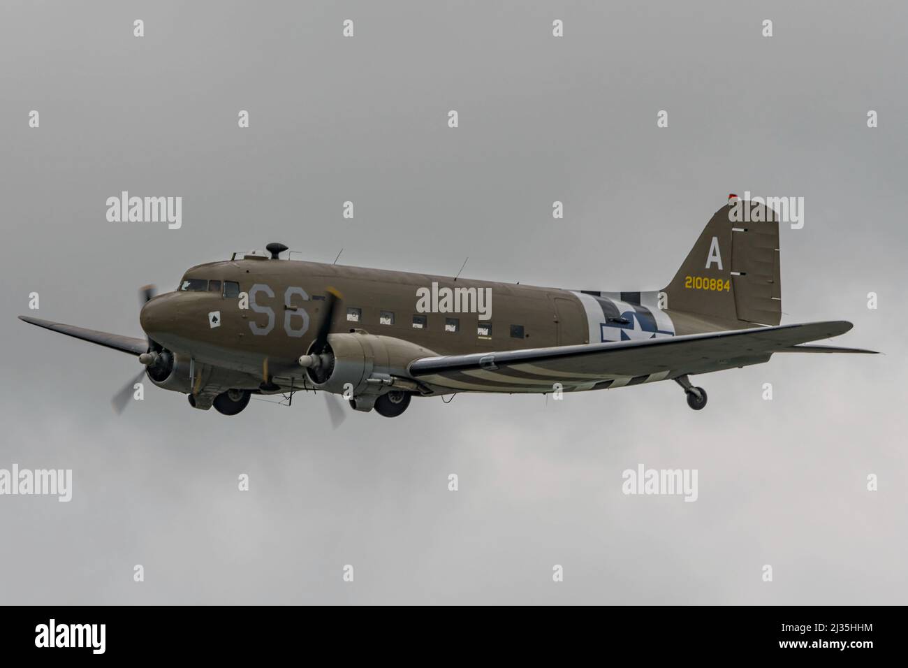 A Douglas C-47 Skytrain WW2 transport aircraft in the sky above Dunsfold Aerodrome, UK for the last ever Wings & Wheels airshow on the 16th June 2019. Stock Photo