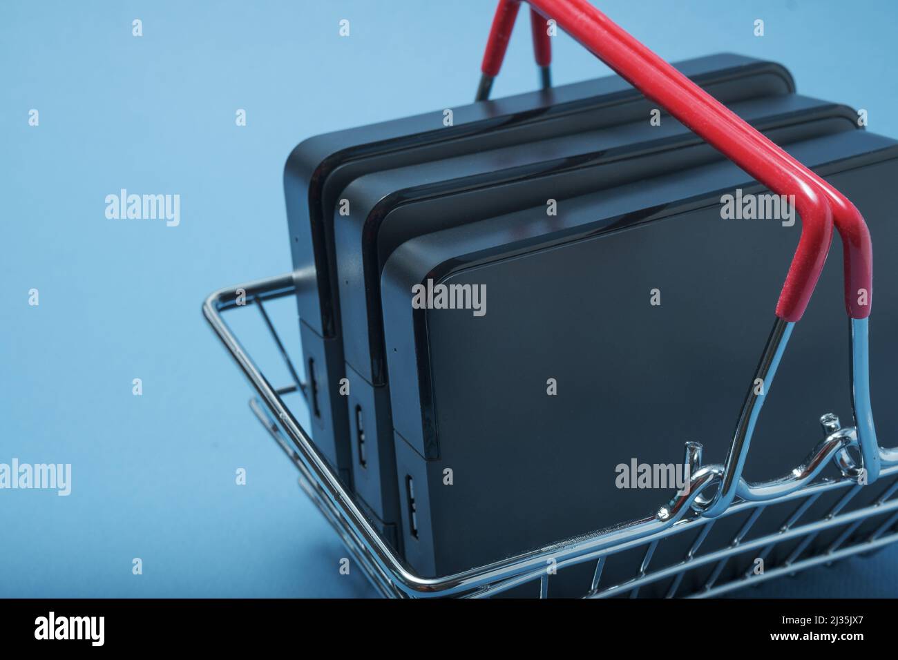 A stack of hard drives in a basket. Stock Photo