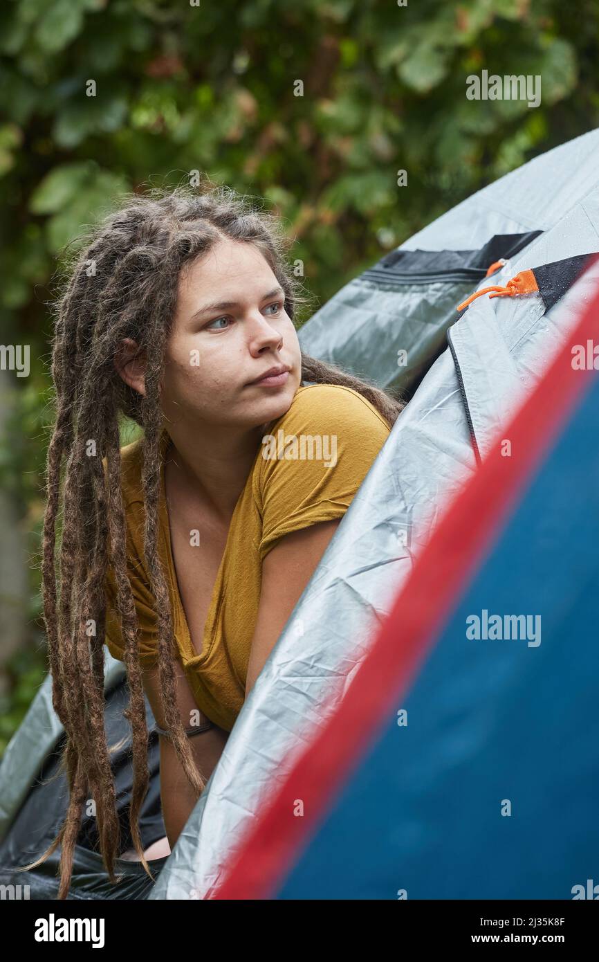 Woman getting out the tent Stock Photo