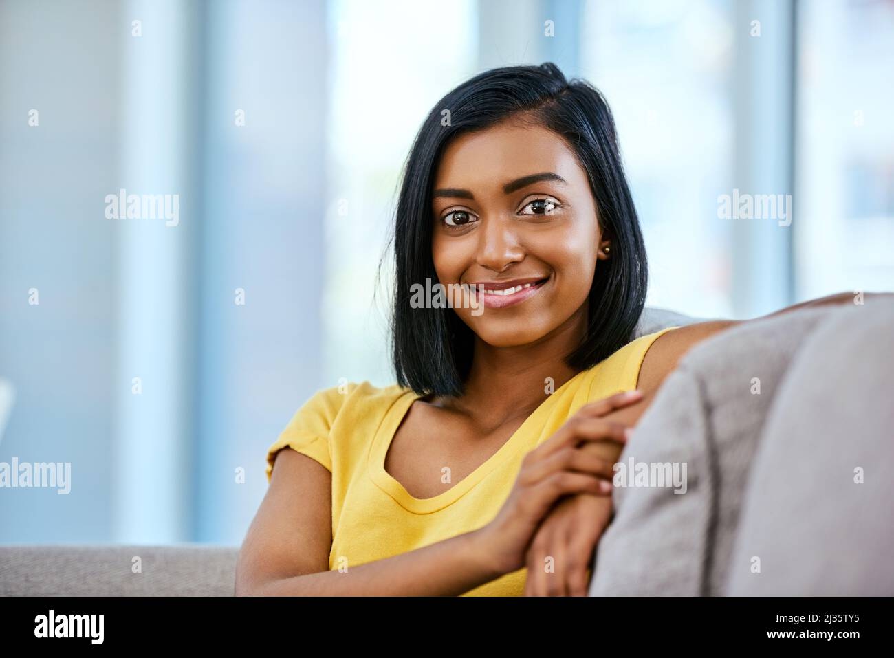 Comfortably chilling at home just how I like it. Portrait of a teenage girl spending the day at home. Stock Photo