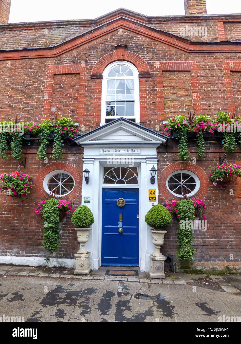 Flowers adorn Harmondsworth Hall, a guesthouse in Harmondsworth, Hillingdon, Middlesex, London, England, UK. Stock Photo