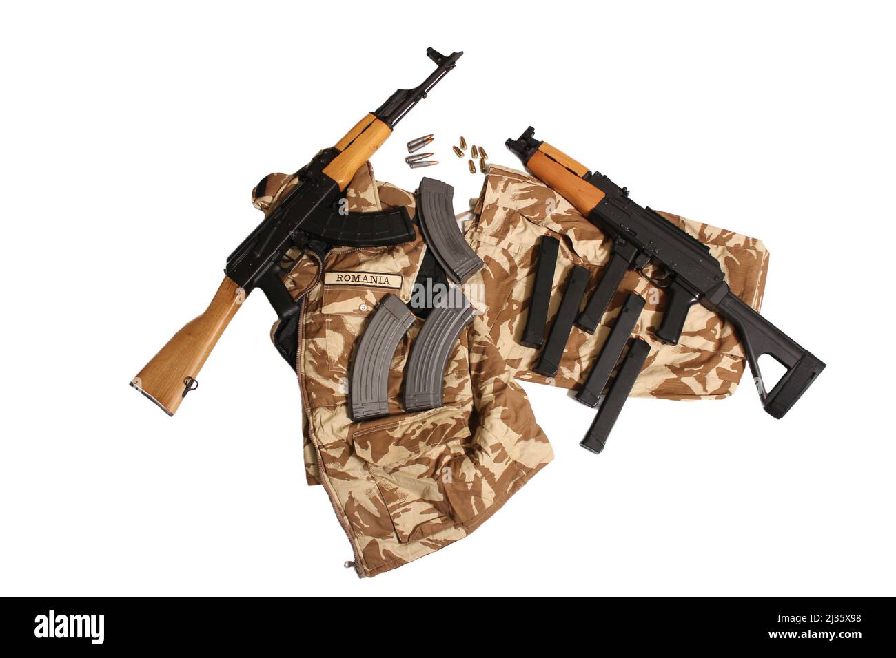 Romanian AK47 and AK47 Pistol on Romanian Military Uniform on White Background Stock Photo