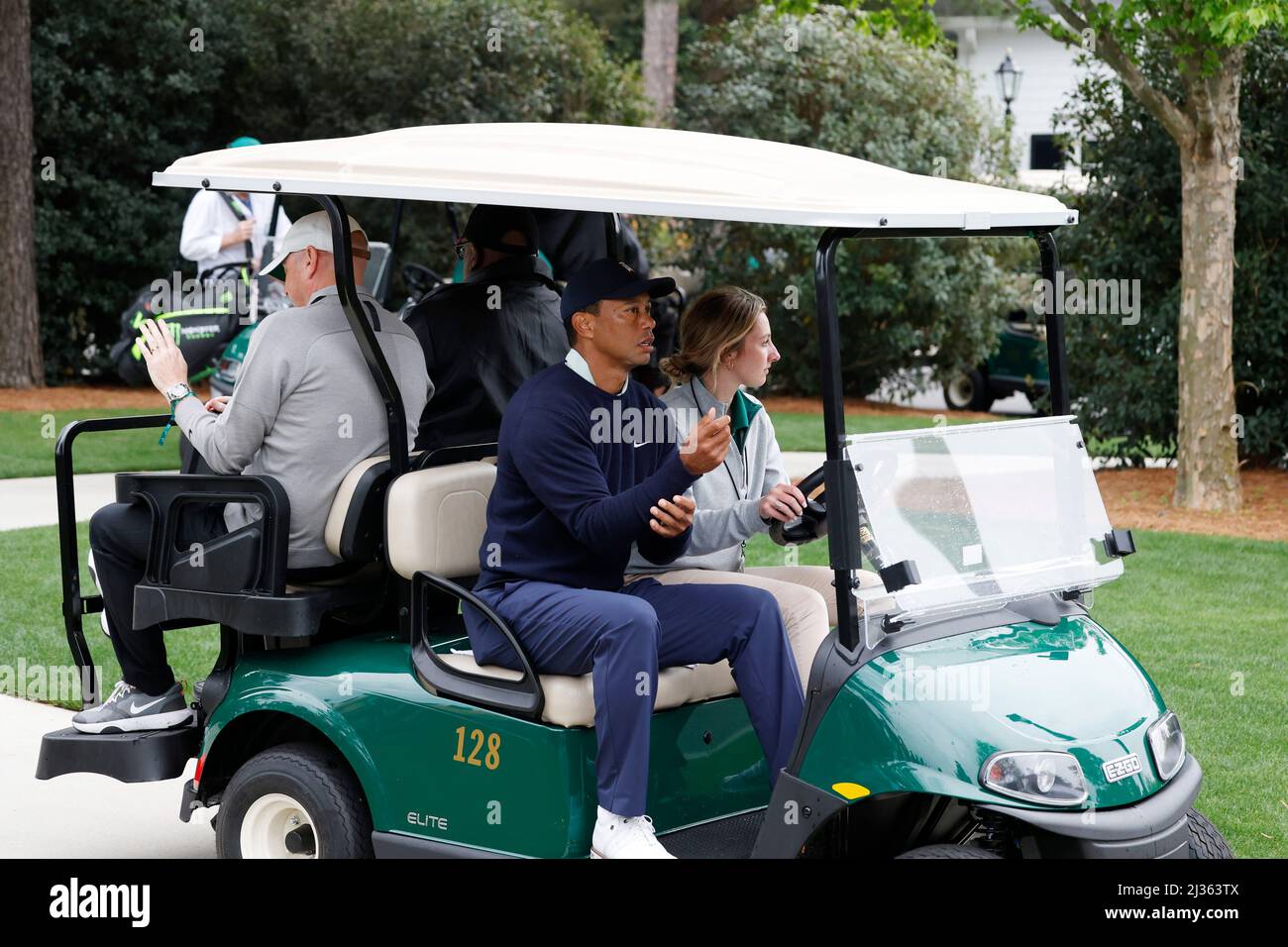 Augusta, GA - April 05: Tiger Woods gets a ride on a golf cart as he leaves  the practice range on April 5, 2022 before the start of the 2022 Masters at