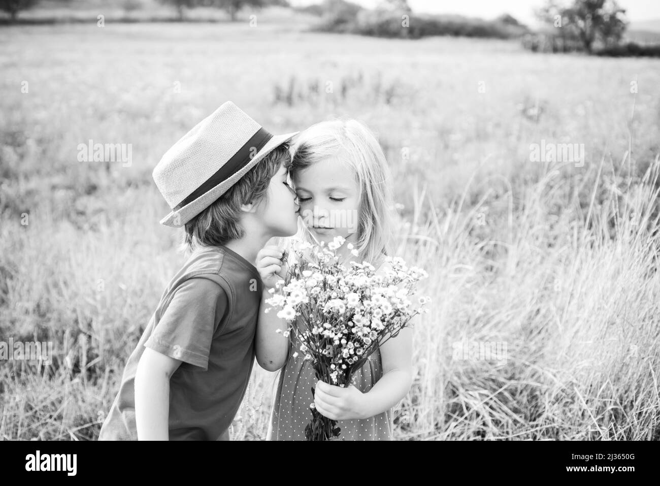 Love. Valentines day. Festive Art Greeting Card. Childhood on countryside. Lovely children. Human emotions - kids first love. Cute little children Stock Photo