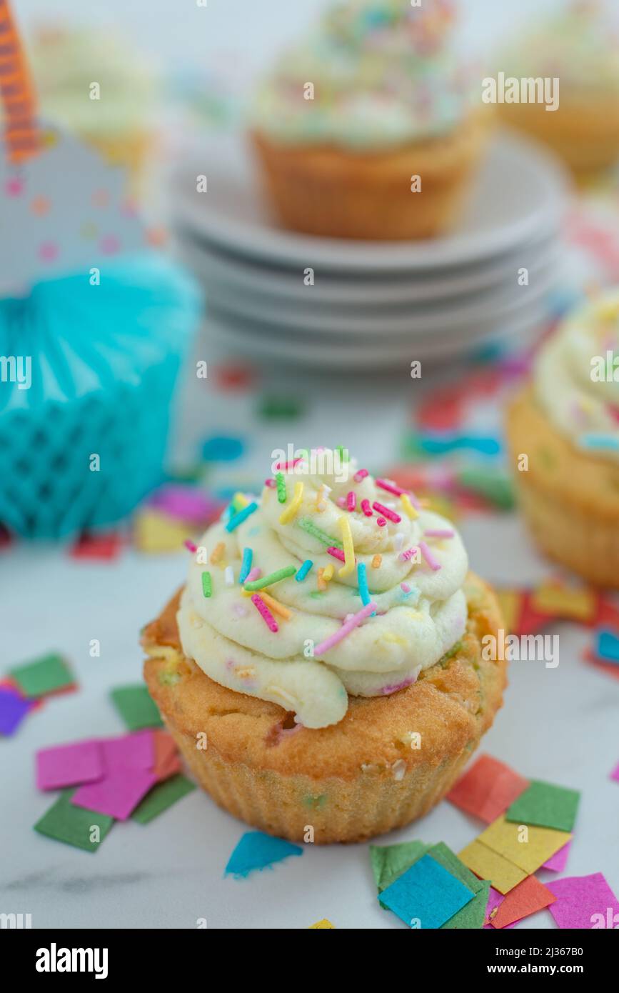sprinkled vanilla cupcakes Stock Photo