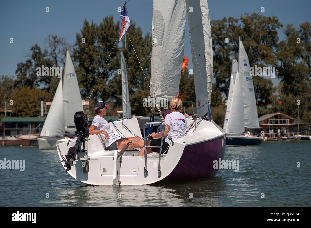 Belgrade, Serbia, Aug 18, 2019: All-female crew competing in Micro Class sailing regatta on Sava River Stock Photo