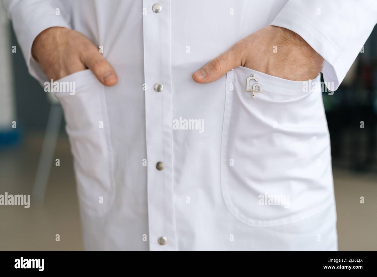 Close-up cropped shot of unrecognizable male doctor wearing white ...
