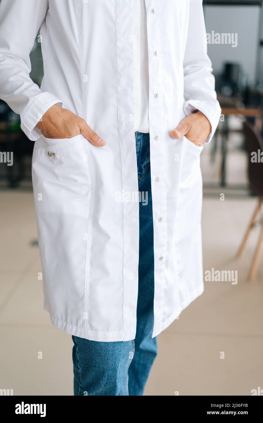 Close-up vertical cropped shot of unrecognizable female doctor in white ...