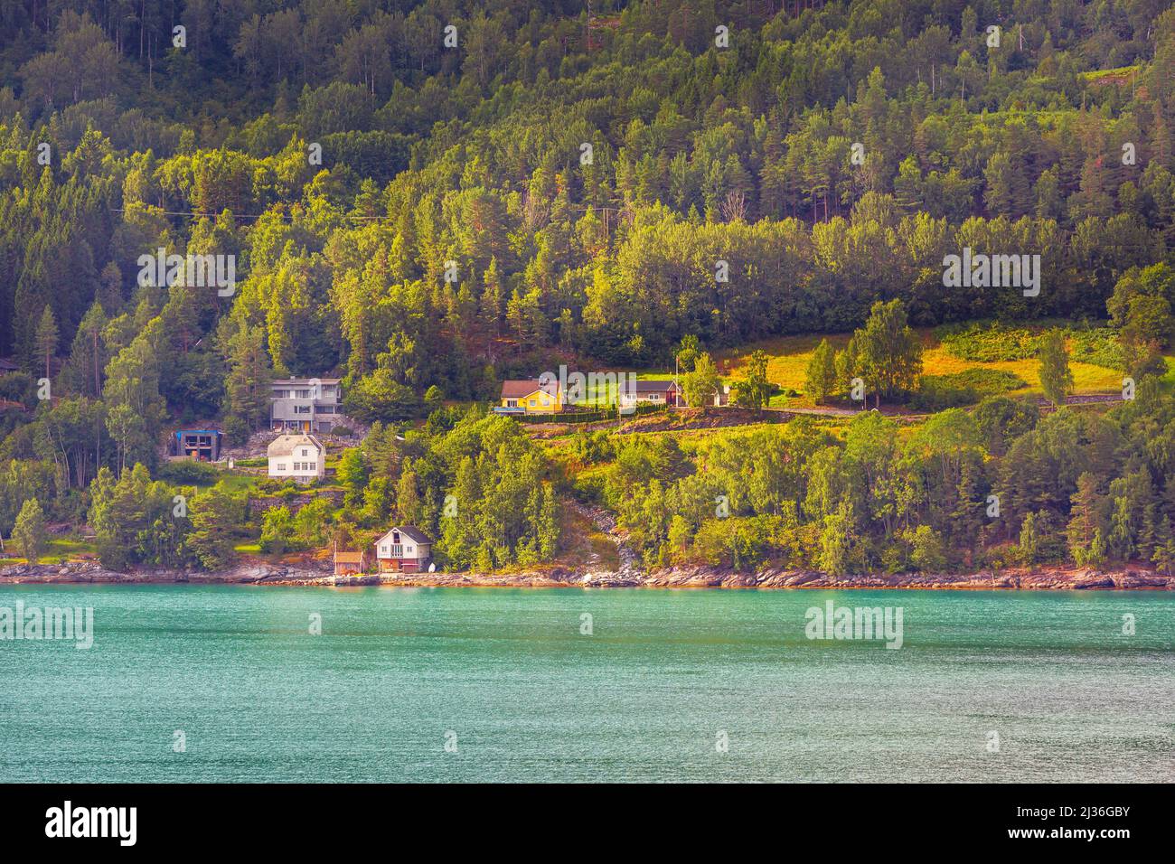 Norwegian village landscape near fjord, mountains and colorful houses