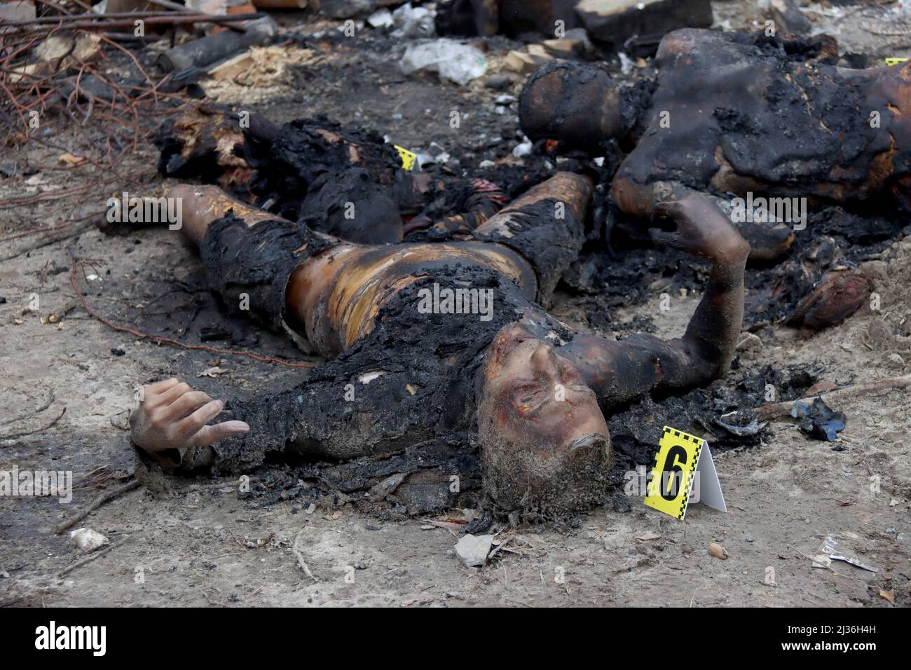 Non Exclusive: BUCHA, UKRAINE- APRIL 5, 2022 - The bodies of civilians killed by Russian occupiers who later attempted to burn them to hide their crim Stock Photo