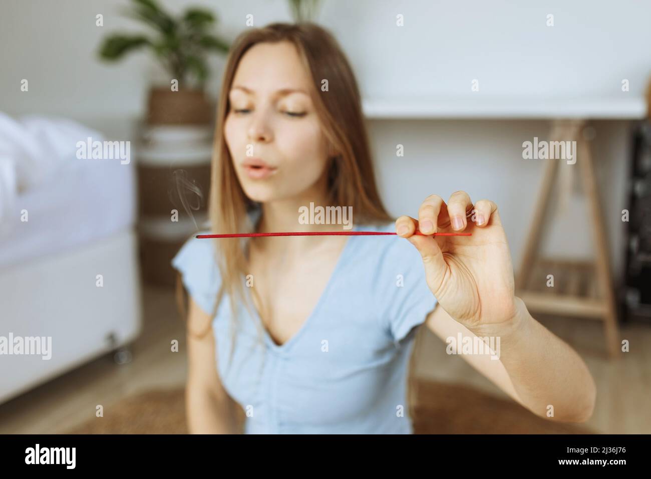 Indian woman holding incense hi-res stock photography and images - Alamy