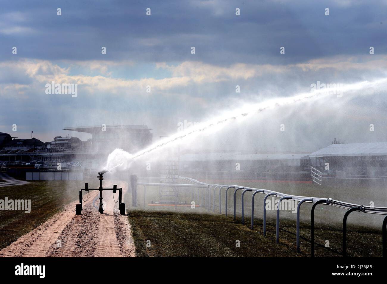 File photo dated 03-04-2013 of watering the track of the Grand National course. Aintree will begin watering on Wednesday morning in anticipation of another drying day ahead of the three-day Grand National meeting which starts on Thursday. Issue date: Wednesday April 6, 2022. Stock Photo