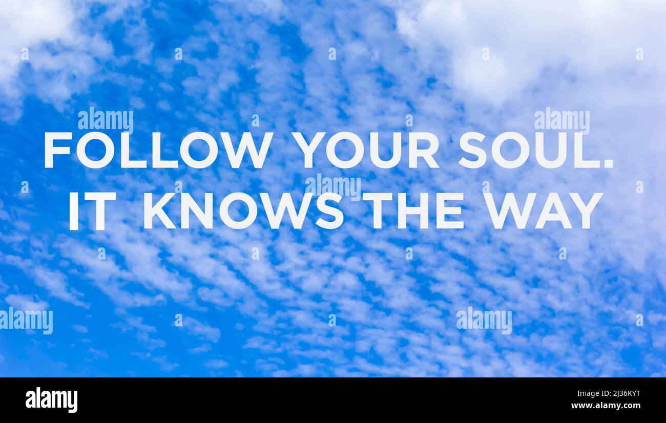 Motivational and inspirational quotes - Follow your soul. It knows the way. Blurred sky background. Stock Photo