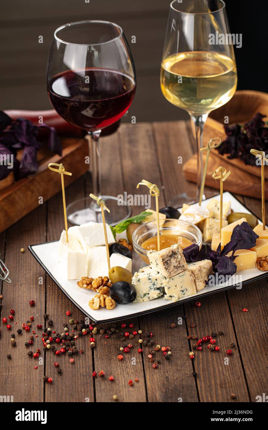 Assorted cheese appetizer platter with honey Stock Photo Alamy
