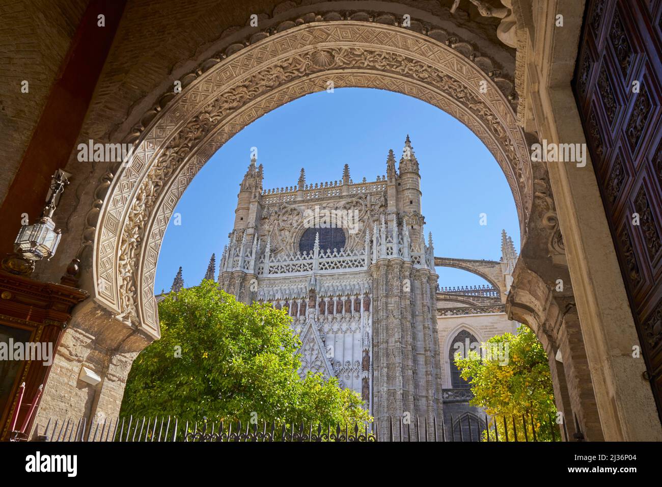 Cathedral of Santa Maria de la Sede, Seville, through Puerta del Perdon Stock Photo
