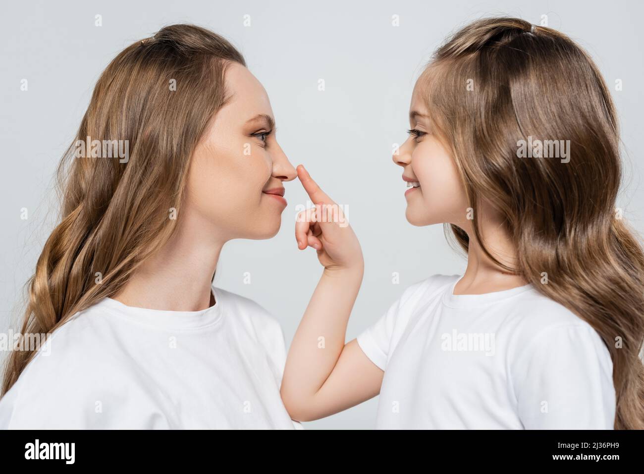 Girl touching nose isolated hires stock photography and images Alamy