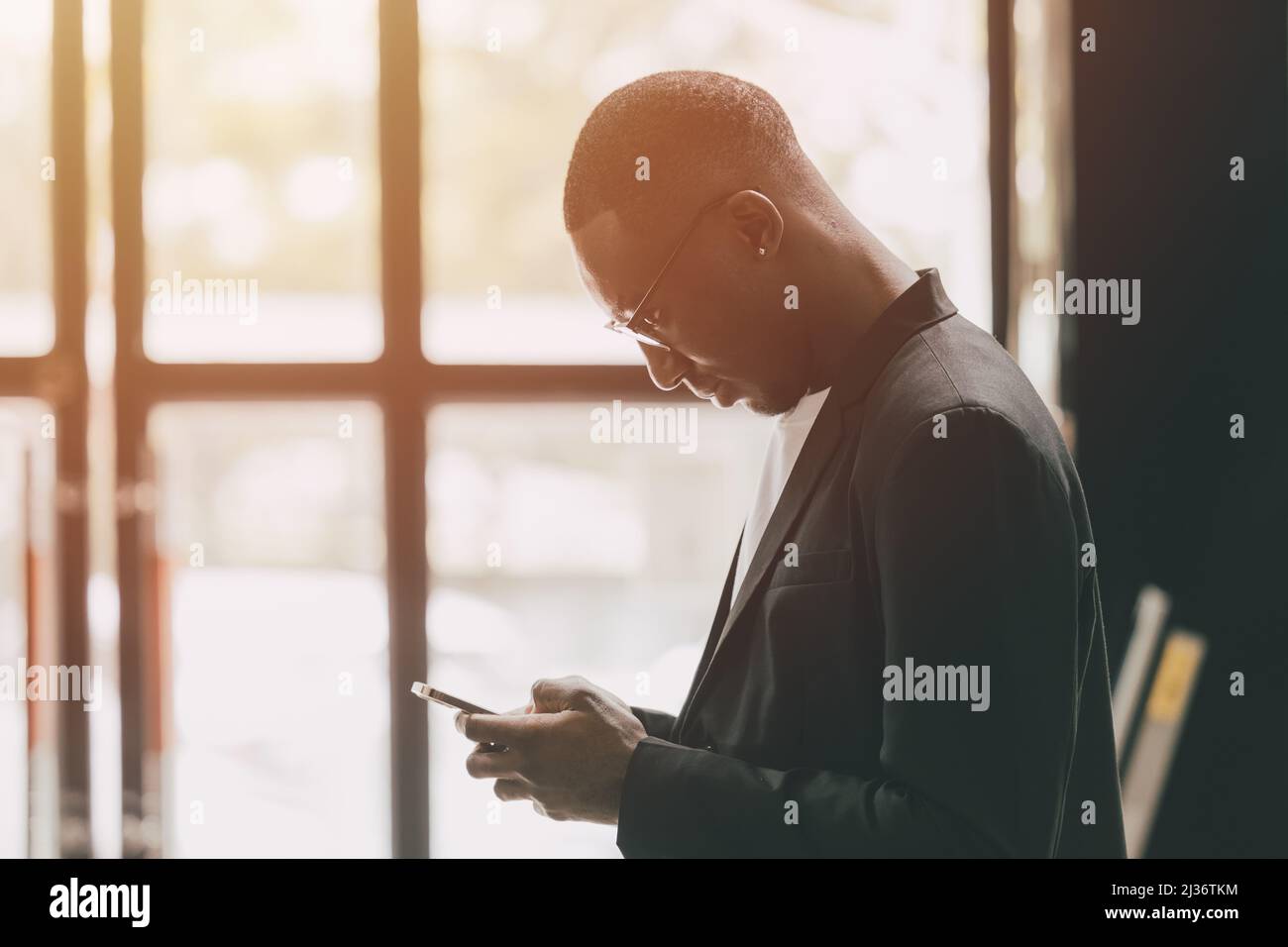 black business man using smartphone touch screen for contact people Stock Photo