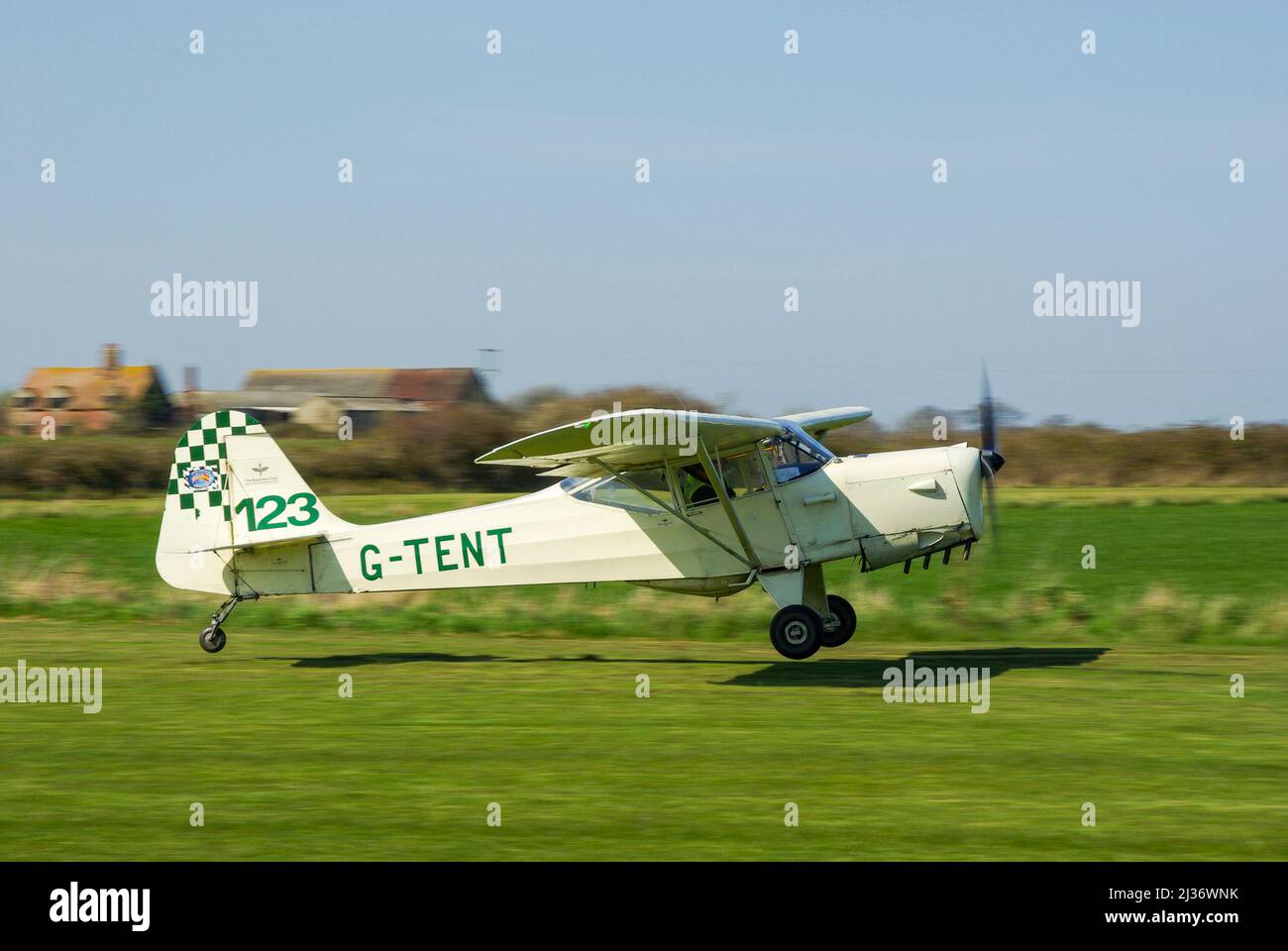 Auster J-1N Alpha vintage light aircraft plane G-TENT taking off to race in the air race at Great Oakley, UK. Classic airplane lifting off from grass Stock Photo