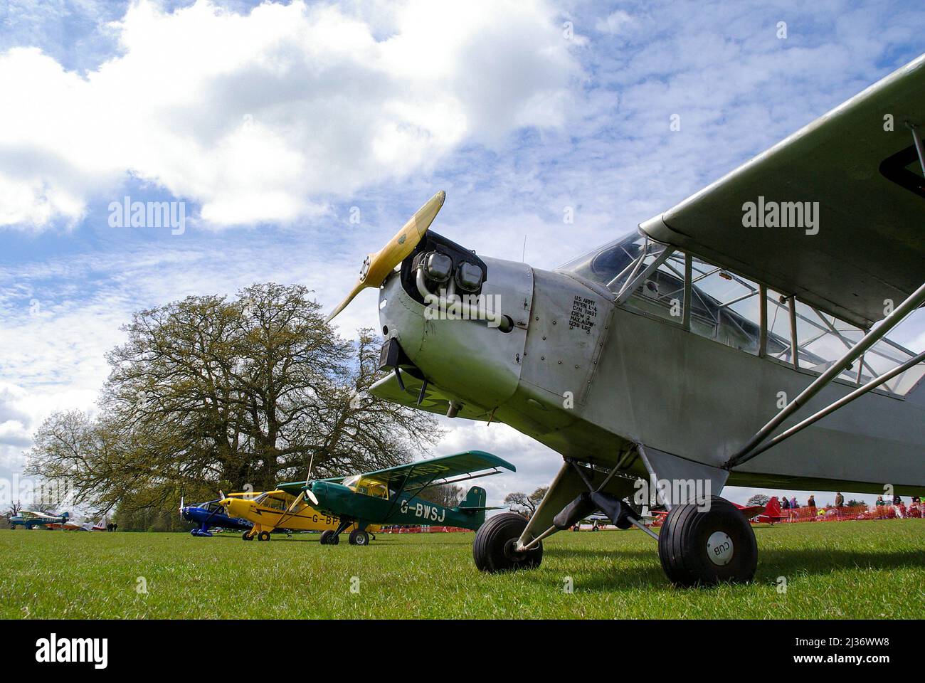 Event at Henham Park rural countryside in Suffolk, UK. Henham Park Wings & Wheels Rally 2010 charity show by Halesworth Lions. Fly-in planes on grass Stock Photo